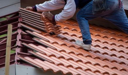 Roofing materials arranged neatly for installation during a service project.